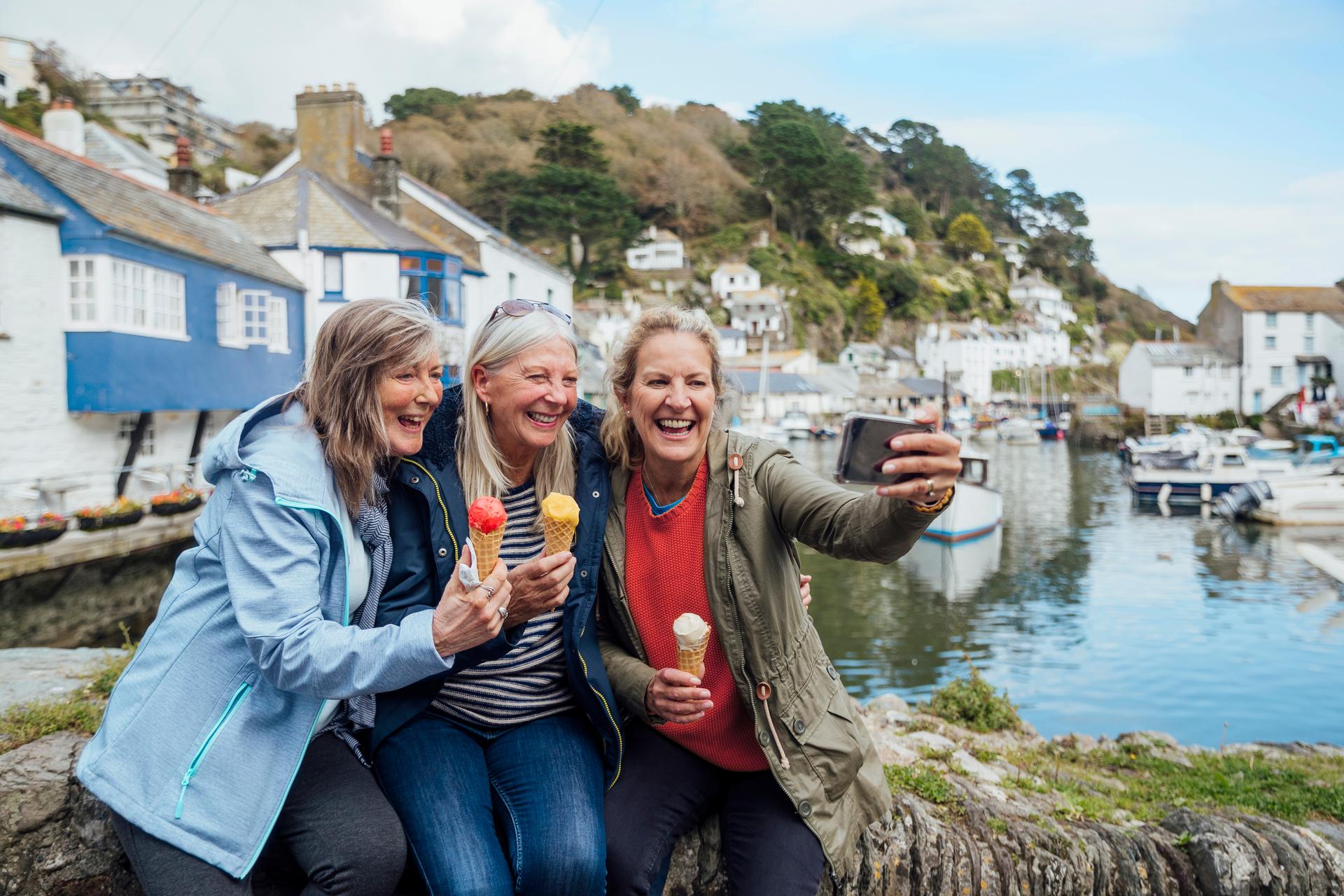 Mature female friends taking selfie