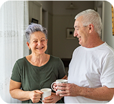 Older couple drinking coffee