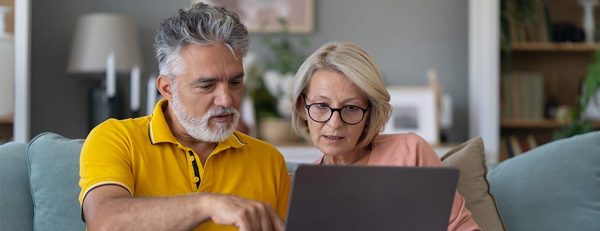 Man and woman looking at laptop