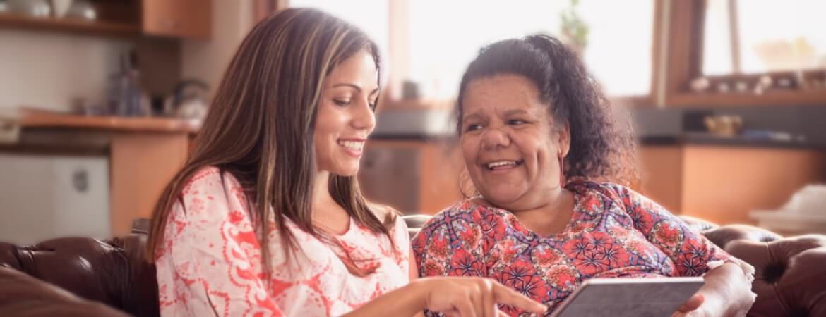 Mother and daughter looking at tablet