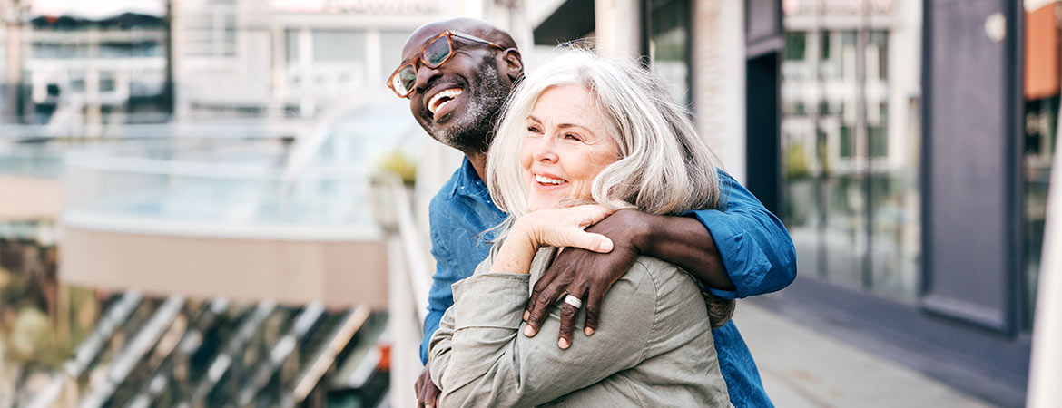 Candid photo of man and woman smiling